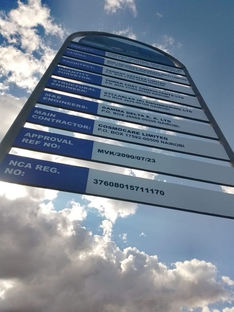 Site signboard-a sign with blue and white text