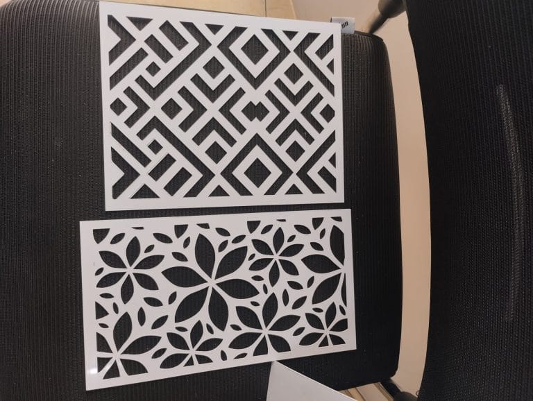 Intricate laser cut panels with geometric and floral patterns for home decor and interior design.