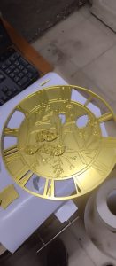 Laser cut bird clock on gold mirror acrylic