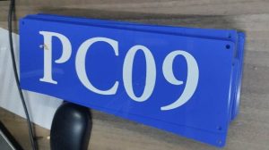 laser engraved door sign on blue acrylic