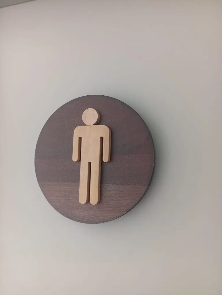 Wooden gents toilet sign